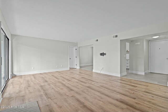 280 Sugar Gum Ln # 165, Pinehurst, NC 28374 - unfurnished living room with light wood-type flooring and baseboards