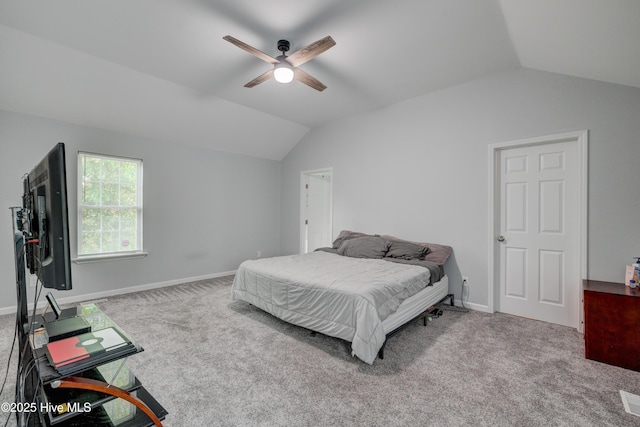 bedroom featuring carpet flooring, baseboards, and lofted ceiling