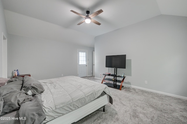 carpeted bedroom featuring baseboards, a ceiling fan, and vaulted ceiling