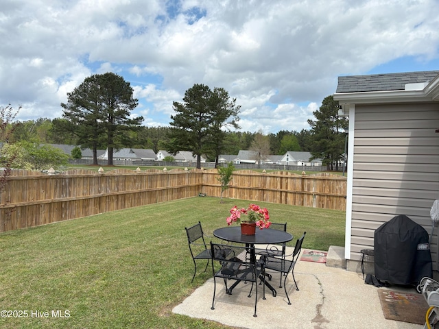 view of yard with a patio and fence