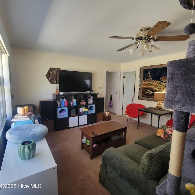 living area with carpet flooring and a ceiling fan
