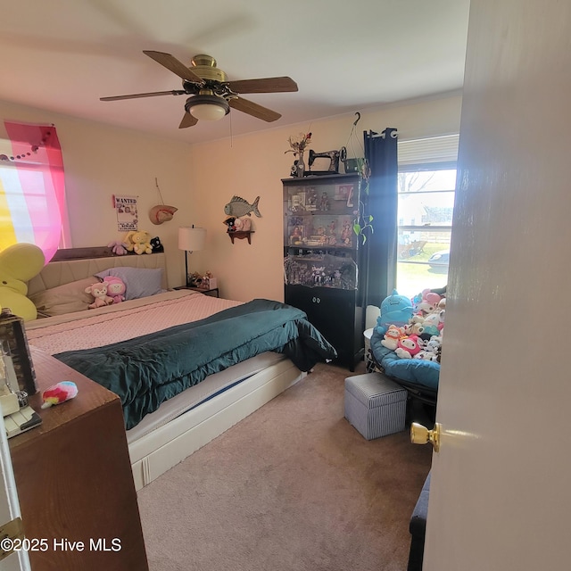 carpeted bedroom with a ceiling fan