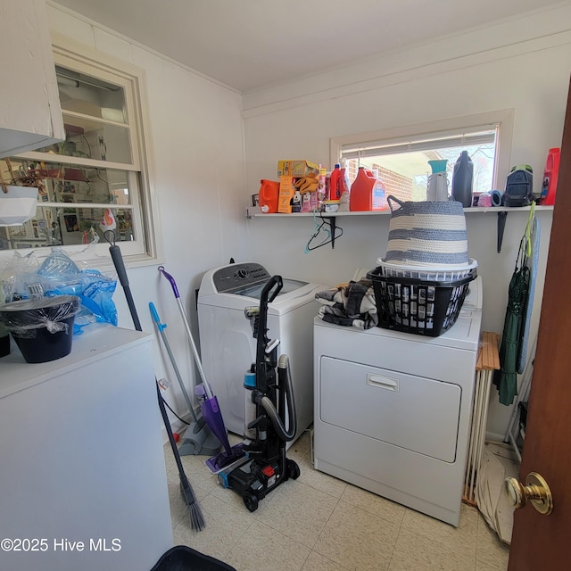 laundry area featuring laundry area, separate washer and dryer, and light floors