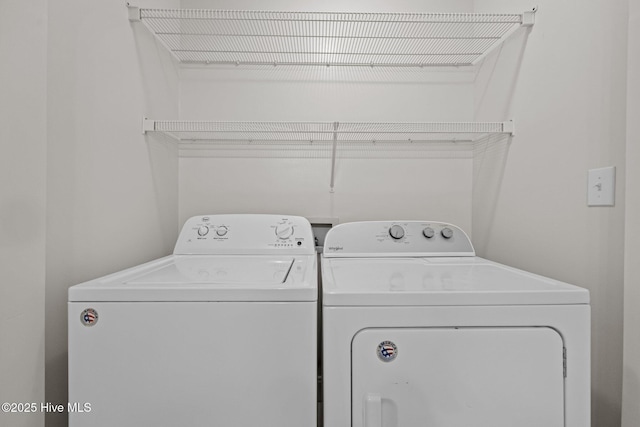 laundry room with washing machine and dryer and laundry area