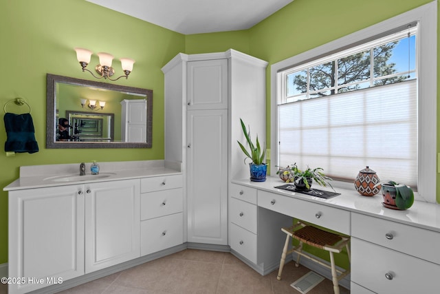 174 Banbridge Dr, West End, NC 27376 - bathroom with a chandelier, tile patterned flooring, and vanity
