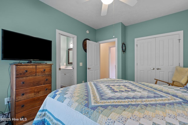 bedroom with a closet, a sink, ceiling fan, and ensuite bath