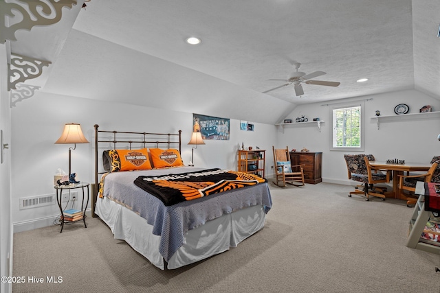 bedroom featuring visible vents, carpet, baseboards, and vaulted ceiling