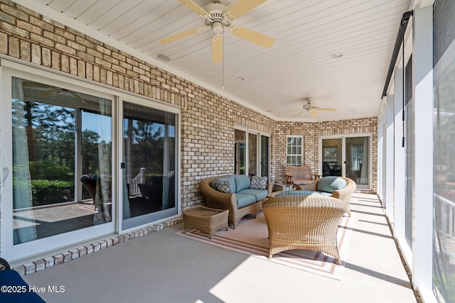view of patio featuring an outdoor living space and ceiling fan