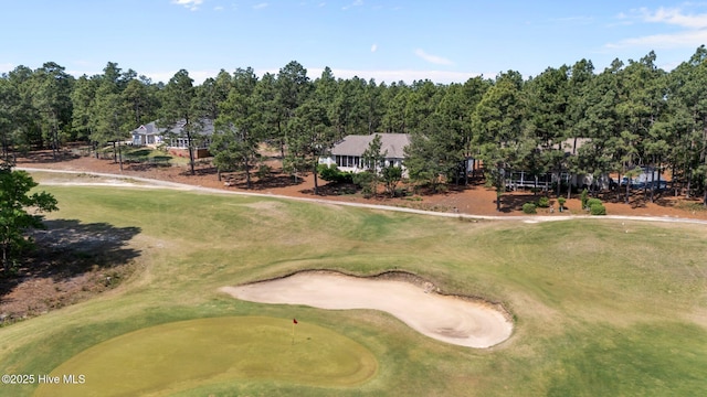 birds eye view of property with golf course view