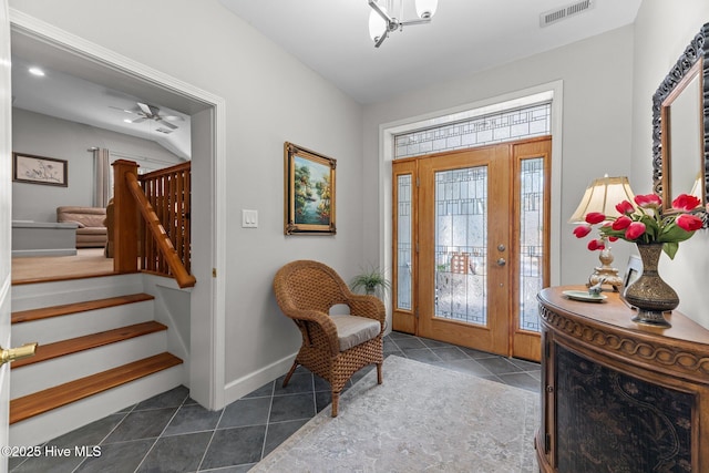 222 Brite Ln, Oriental, NC 28571 - entrance foyer with baseboards, visible vents, stairway, and dark tile patterned flooring