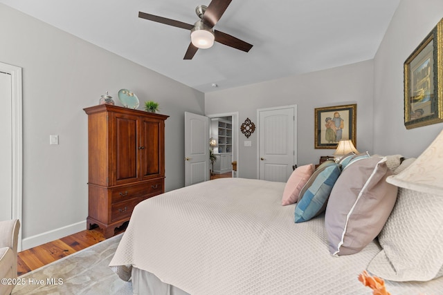 222 Brite Ln, Oriental, NC 28571 - bedroom with baseboards, wood finished floors, and a ceiling fan