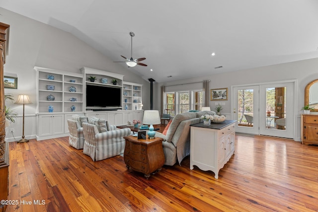 222 Brite Ln, Oriental, NC 28571 - living area with vaulted ceiling, a ceiling fan, a wood stove, light wood-style floors, and recessed lighting