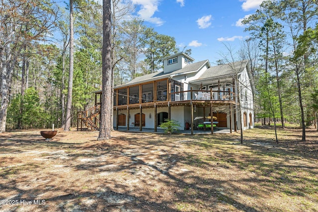 222 Brite Ln, Oriental, NC 28571 - back of house with stairs, a wooden deck, and a sunroom