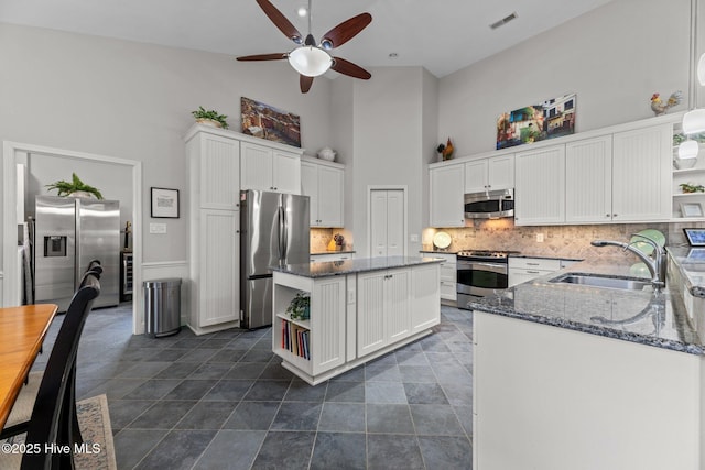 222 Brite Ln, Oriental, NC 28571 - kitchen featuring high vaulted ceiling, a ceiling fan, appliances with stainless steel finishes, a sink, and open shelves