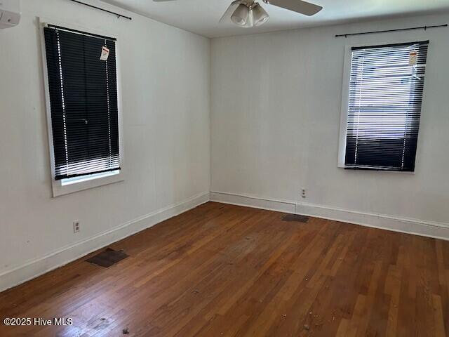 902 Johnston St, Edenton, NC 27932 - spare room featuring baseboards, visible vents, wood finished floors, and ceiling fan