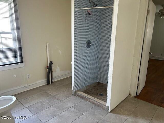 902 Johnston St, Edenton, NC 27932 - full bath with tile patterned flooring, a stall shower, and baseboards