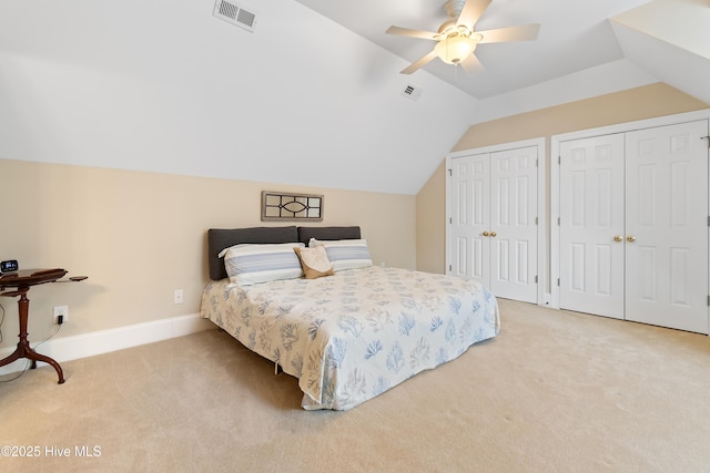 full bathroom with vaulted ceiling, vanity, and tile patterned floors