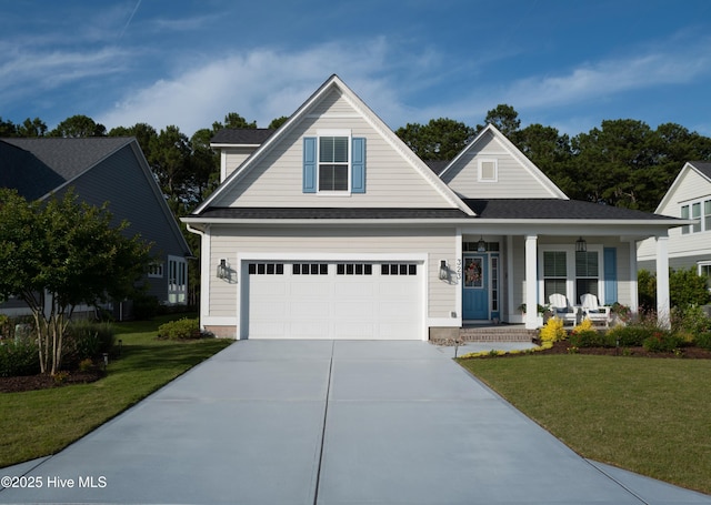 323 Lightning Bug Ln, Holly Ridge, NC 28445 - traditional-style home featuring a porch, driveway, a front lawn, and a shingled roof