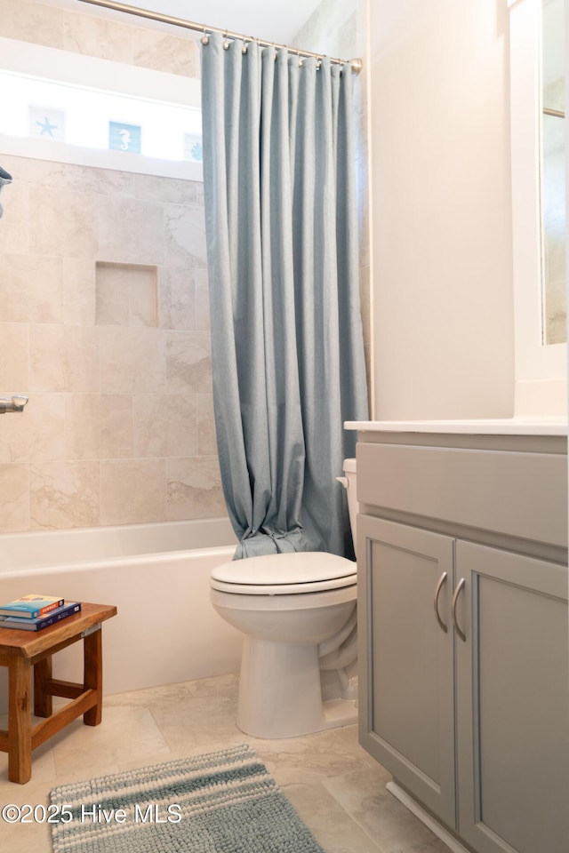 323 Lightning Bug Ln, Holly Ridge, NC 28445 - full bathroom featuring shower / bathtub combination with curtain, toilet, and vanity