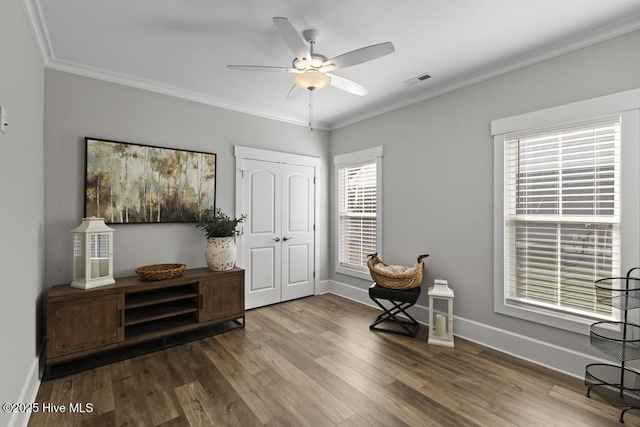 323 Lightning Bug Ln, Holly Ridge, NC 28445 - sitting room featuring wood finished floors, ceiling fan, ornamental molding, plenty of natural light, and baseboards