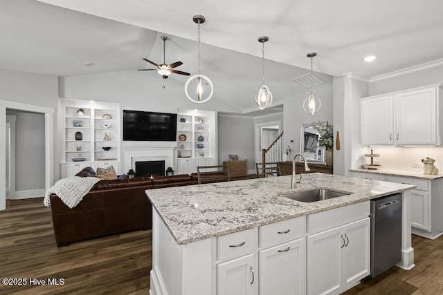 323 Lightning Bug Ln, Holly Ridge, NC 28445 - kitchen featuring a sink, stainless steel dishwasher, a ceiling fan, dark wood-style floors, and a warm lit fireplace