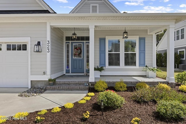 323 Lightning Bug Ln, Holly Ridge, NC 28445 - entrance to property featuring an attached garage and a porch