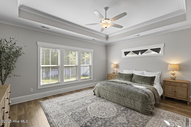 323 Lightning Bug Ln, Holly Ridge, NC 28445 - bedroom with a raised ceiling, ornamental molding, wood finished floors, baseboards, and a ceiling fan