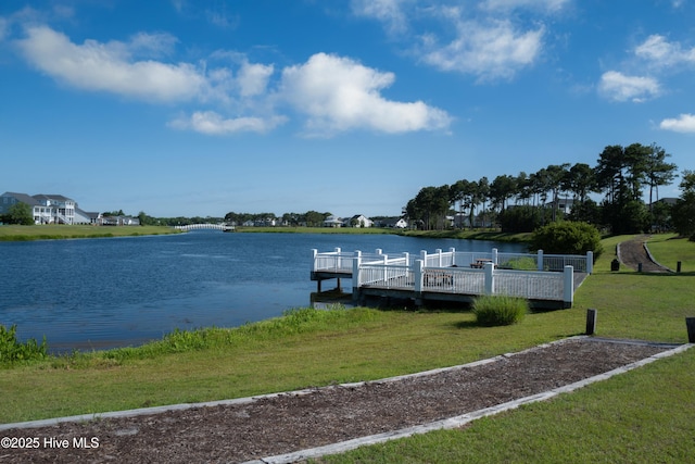 323 Lightning Bug Ln, Holly Ridge, NC 28445 - dock featuring a water view and a lawn