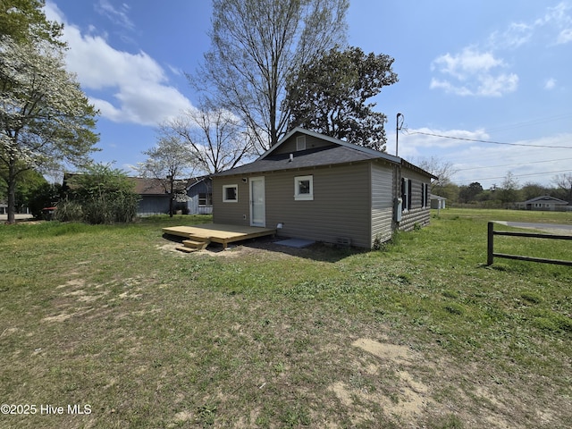 117 Flowers St, Rockingham, NC 28379 - rear view of house featuring a deck and a lawn