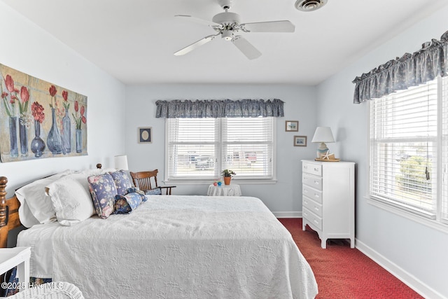 713 Channel Blvd, Topsail Beach, NC 28445 - bedroom featuring baseboards, visible vents, multiple windows, and dark colored carpet