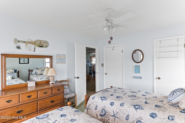 713 Channel Blvd, Topsail Beach, NC 28445 - bedroom featuring carpet flooring, a ceiling fan, and multiple closets