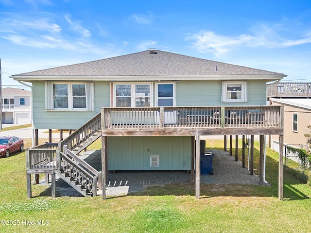 713 Channel Blvd, Topsail Beach, NC 28445 - rear view of house with stairs, a shingled roof, a lawn, and a wooden deck