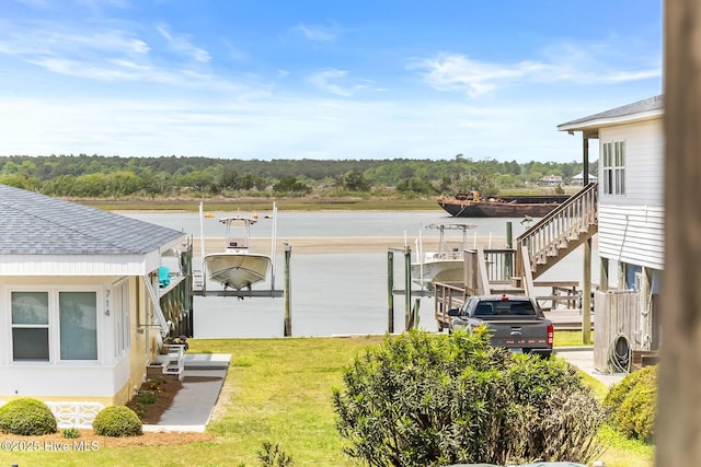 713 Channel Blvd, Topsail Beach, NC 28445 - exterior space with boat lift, a water view, and a dock