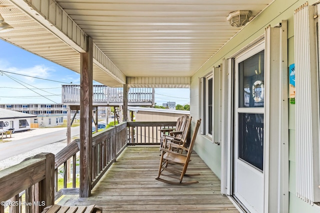 713 Channel Blvd, Topsail Beach, NC 28445 - wooden terrace featuring covered porch