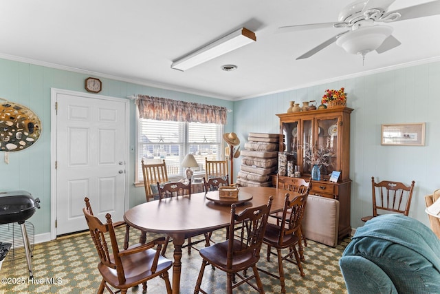 713 Channel Blvd, Topsail Beach, NC 28445 - dining space featuring crown molding, ceiling fan, and baseboards
