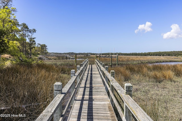 view of dock with a rural view