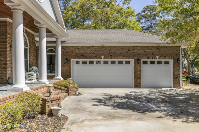 exterior space featuring brick siding, driveway, a shingled roof, and a garage