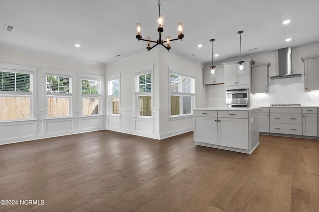 1008 Peace St Lot 69, Leland, NC 28451 - kitchen featuring wall chimney range hood, a chandelier, dark wood-style flooring, recessed lighting, and tasteful backsplash
