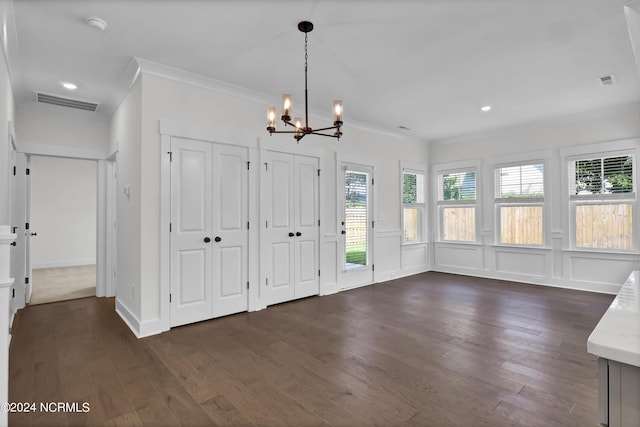 1008 Peace St Lot 69, Leland, NC 28451 - unfurnished dining area with dark wood finished floors, a chandelier, crown molding, recessed lighting, and a decorative wall
