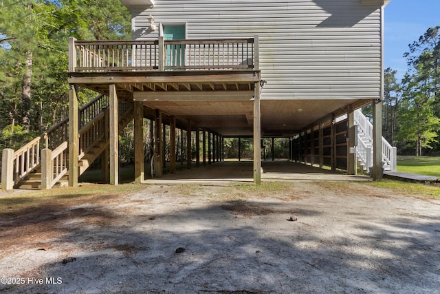 318 Winchester Way, Merritt, NC 28556 - view of community with stairs, a carport, and a deck