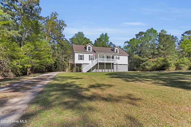 318 Winchester Way, Merritt, NC 28556 - view of front of property with a front lawn, driveway, stairs, and a deck