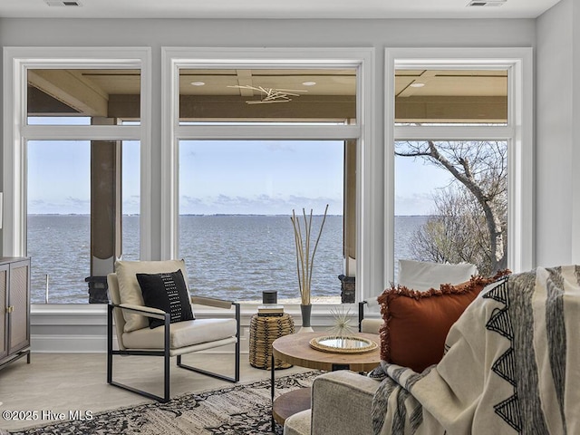 371 Narrow Shore Rd, Aydlett, NC 27916 - sitting room featuring a water view, healthy amount of natural light, and light wood-type flooring