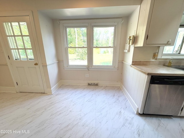 114 Long Leaf Ln, Plymouth, NC 27962 - kitchen featuring marble finish floor, visible vents, wainscoting, stainless steel dishwasher, and baseboards
