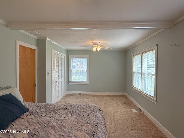 114 Long Leaf Ln, Plymouth, NC 27962 - unfurnished bedroom featuring a closet, light carpet, baseboards, and crown molding