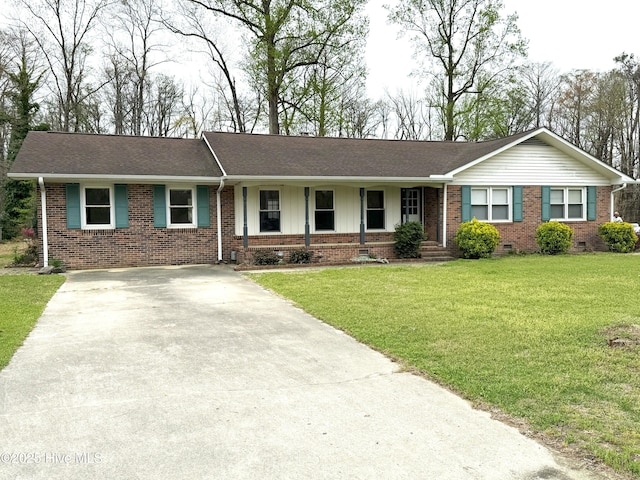 114 Long Leaf Ln, Plymouth, NC 27962 - ranch-style house featuring concrete driveway, brick siding, roof with shingles, and a front yard