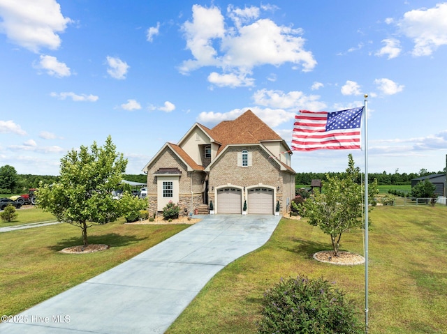 view of front facade with a front yard, stone siding, a garage, and concrete driveway
