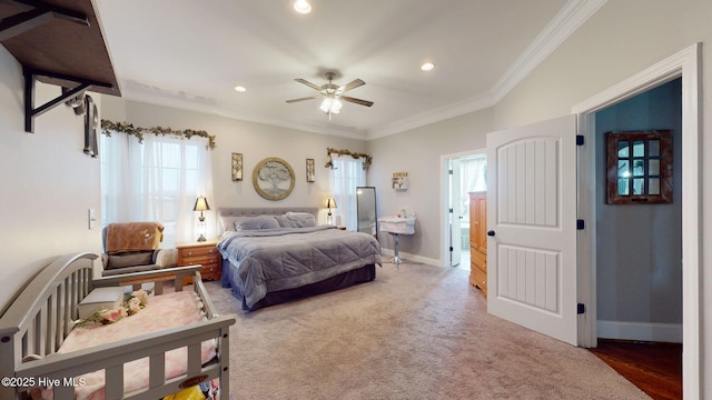 carpeted bedroom featuring crown molding, baseboards, ceiling fan, and recessed lighting