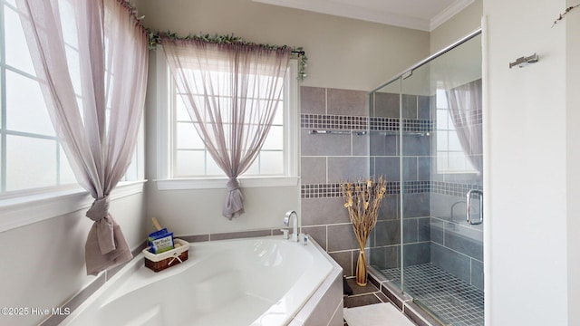 full bath with a shower stall, crown molding, and a bath