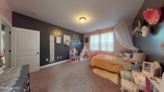 bedroom with carpet and baseboards