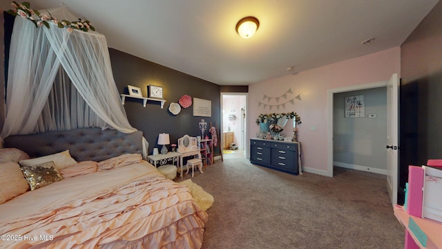 carpeted bedroom featuring baseboards
